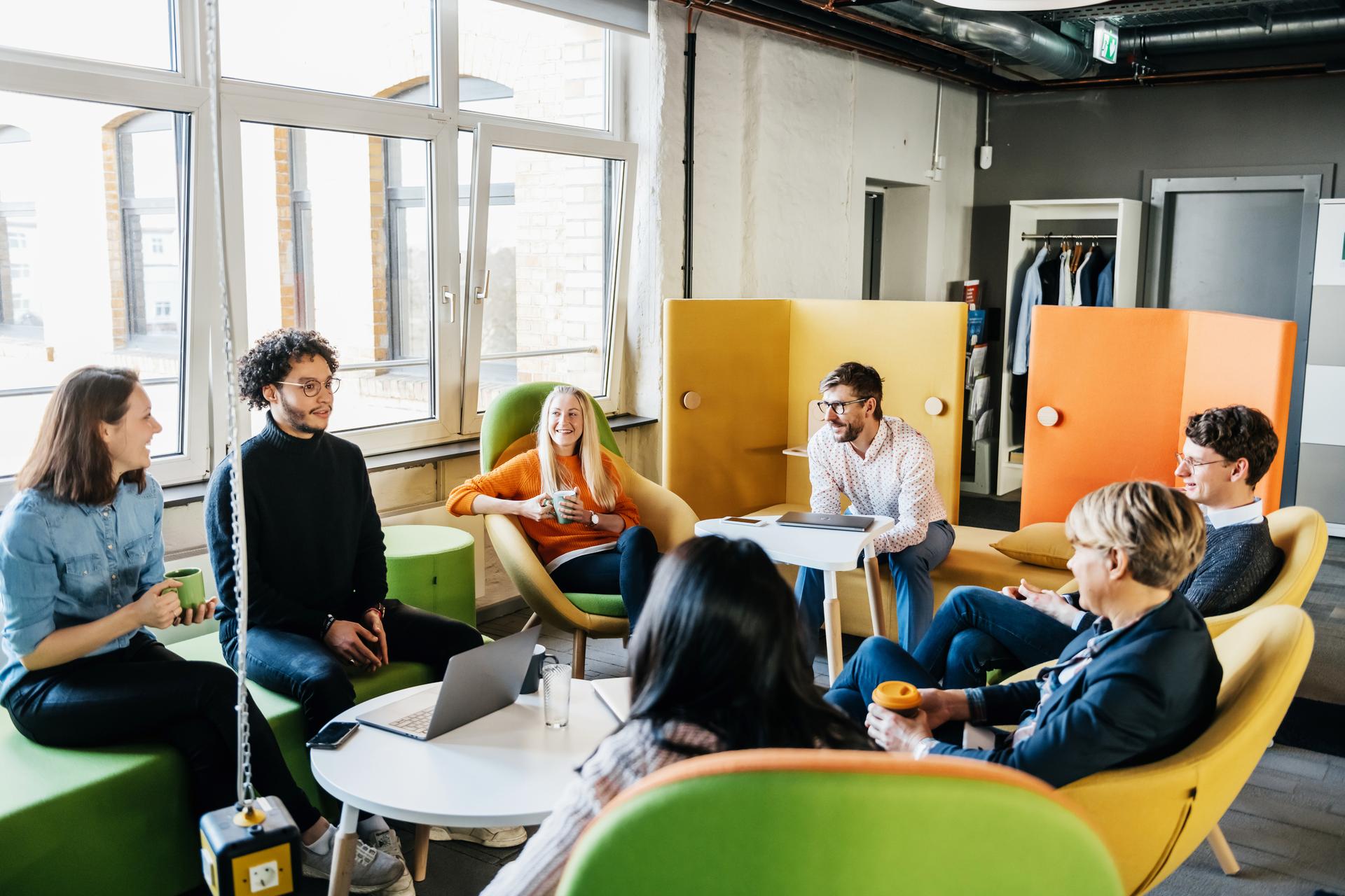 a group of people sitting around a table